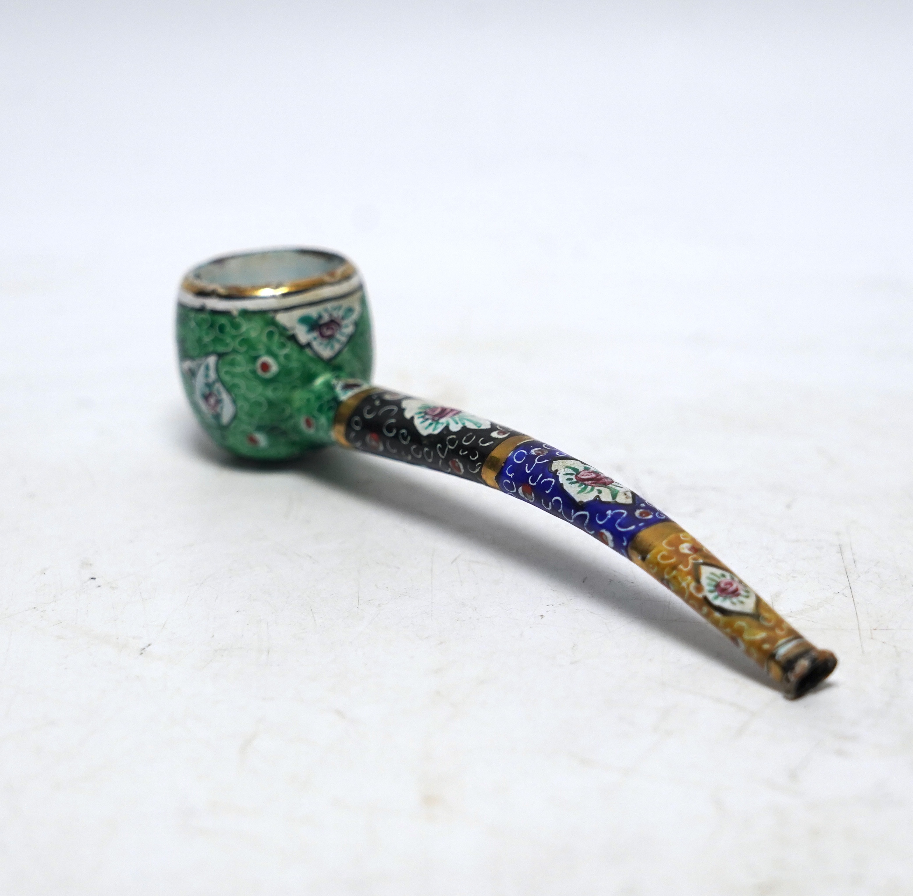 A Persian multicoloured enamelled pipe, 14cm long